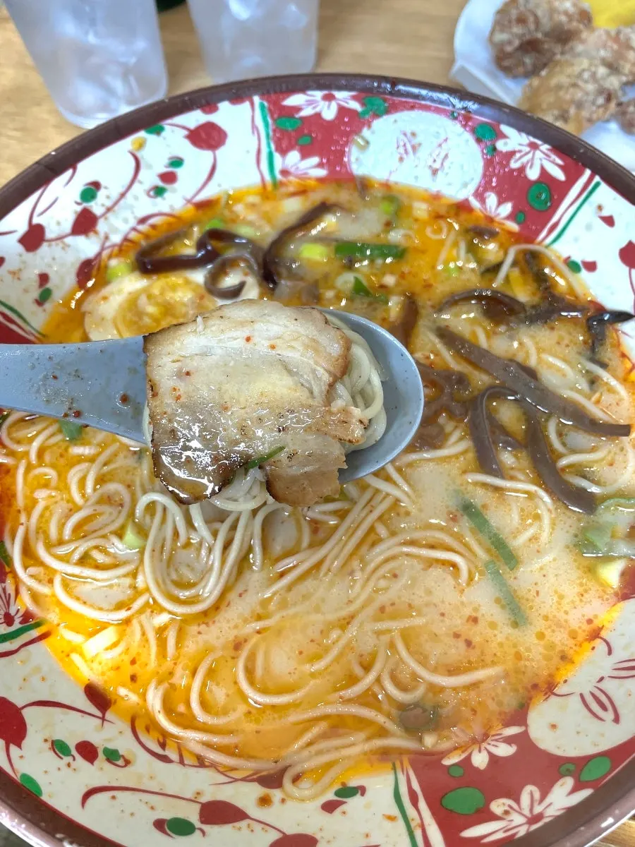Close-up of karai ramen noodles and char siu