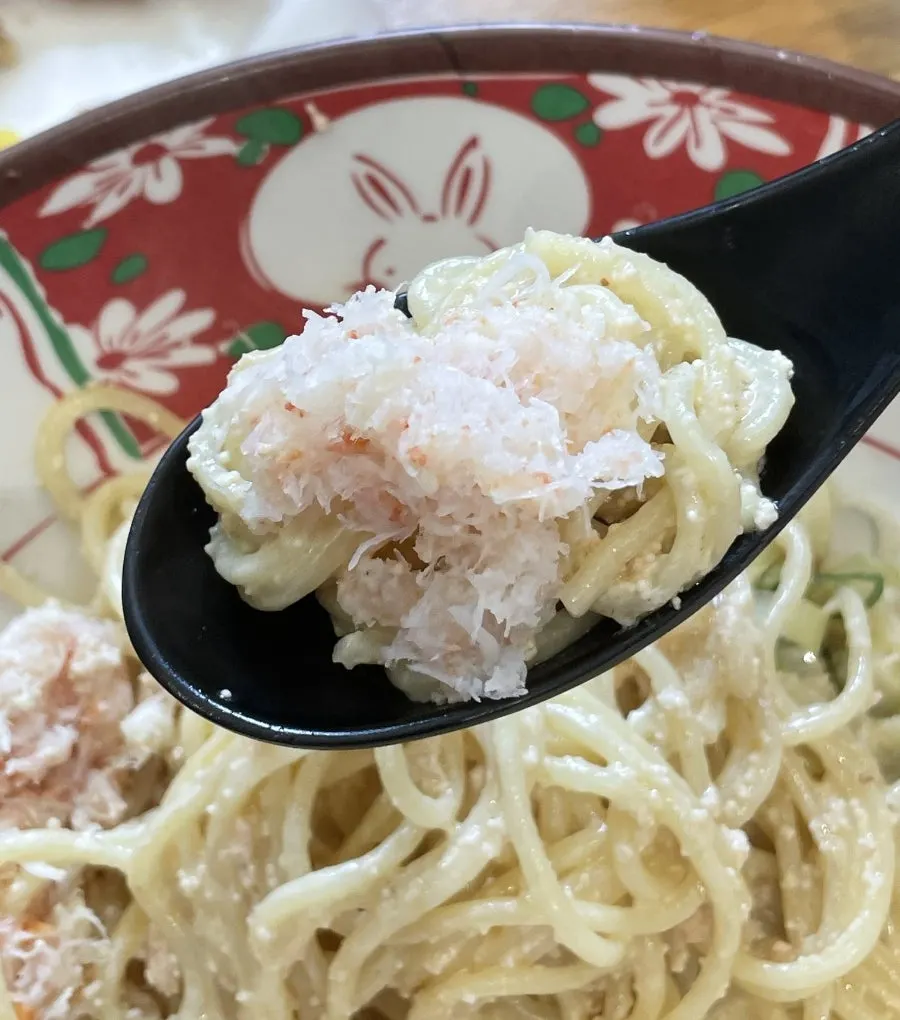 Close-up of crab-topped cream ramen