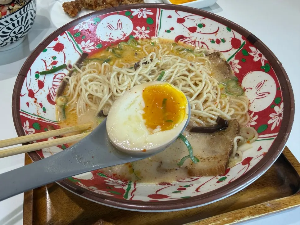 Soft-boiled egg on top of the karai ramen