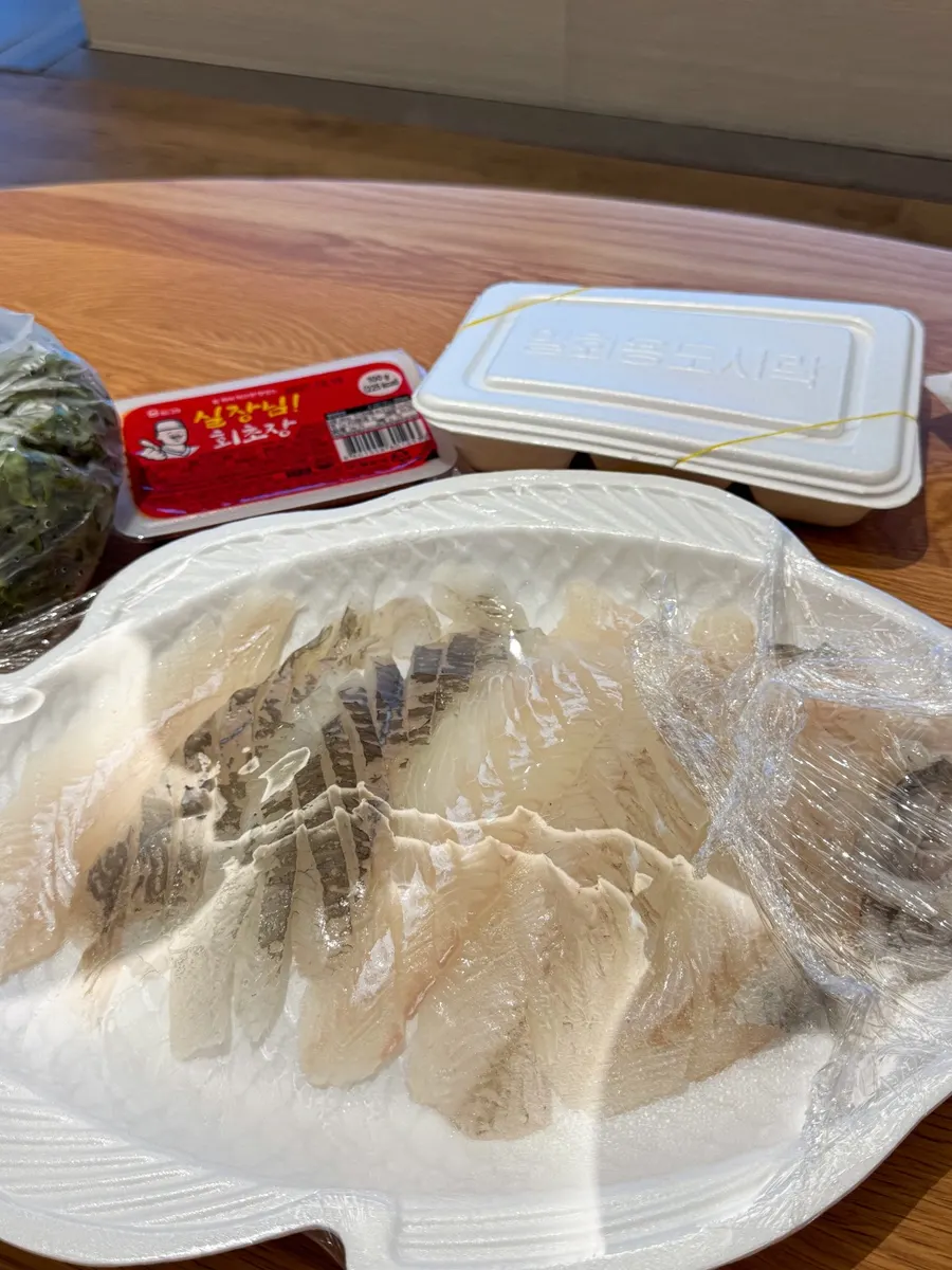 Sashimi takeout containers pulled out at the accommodation