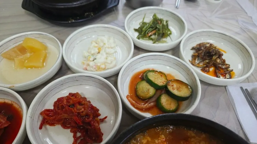 Side dish plate with buckwheat crepe and kimchi