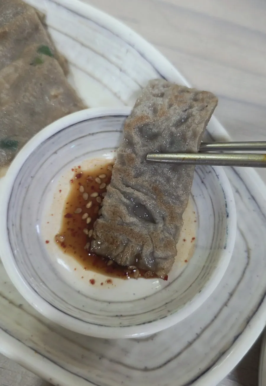 A spoonful of rice with salted seafood