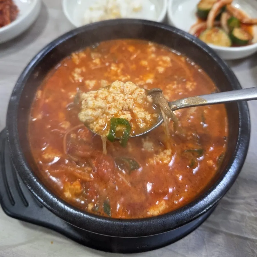Close-up of the spicy broth in the sundubu pot