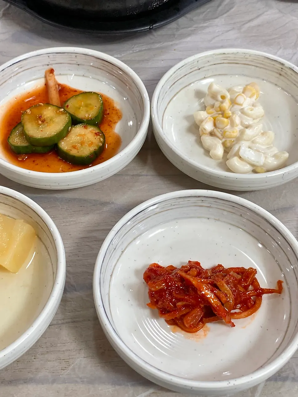 Nine side dishes set on the table after ordering