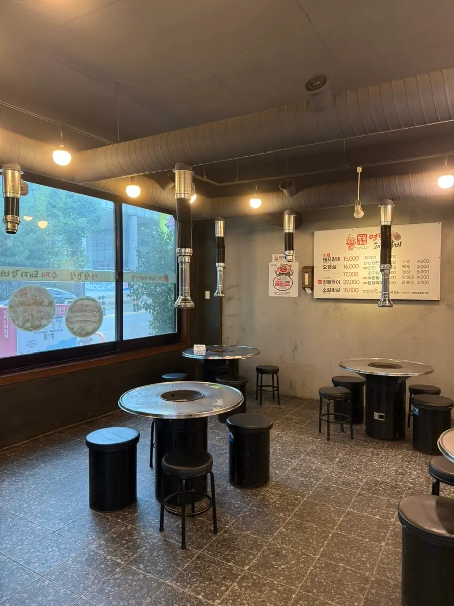 Dining hall with charcoal grill tables