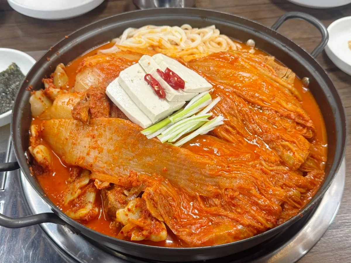 Complimentary side dishes for aged-kimchi braised pork bones