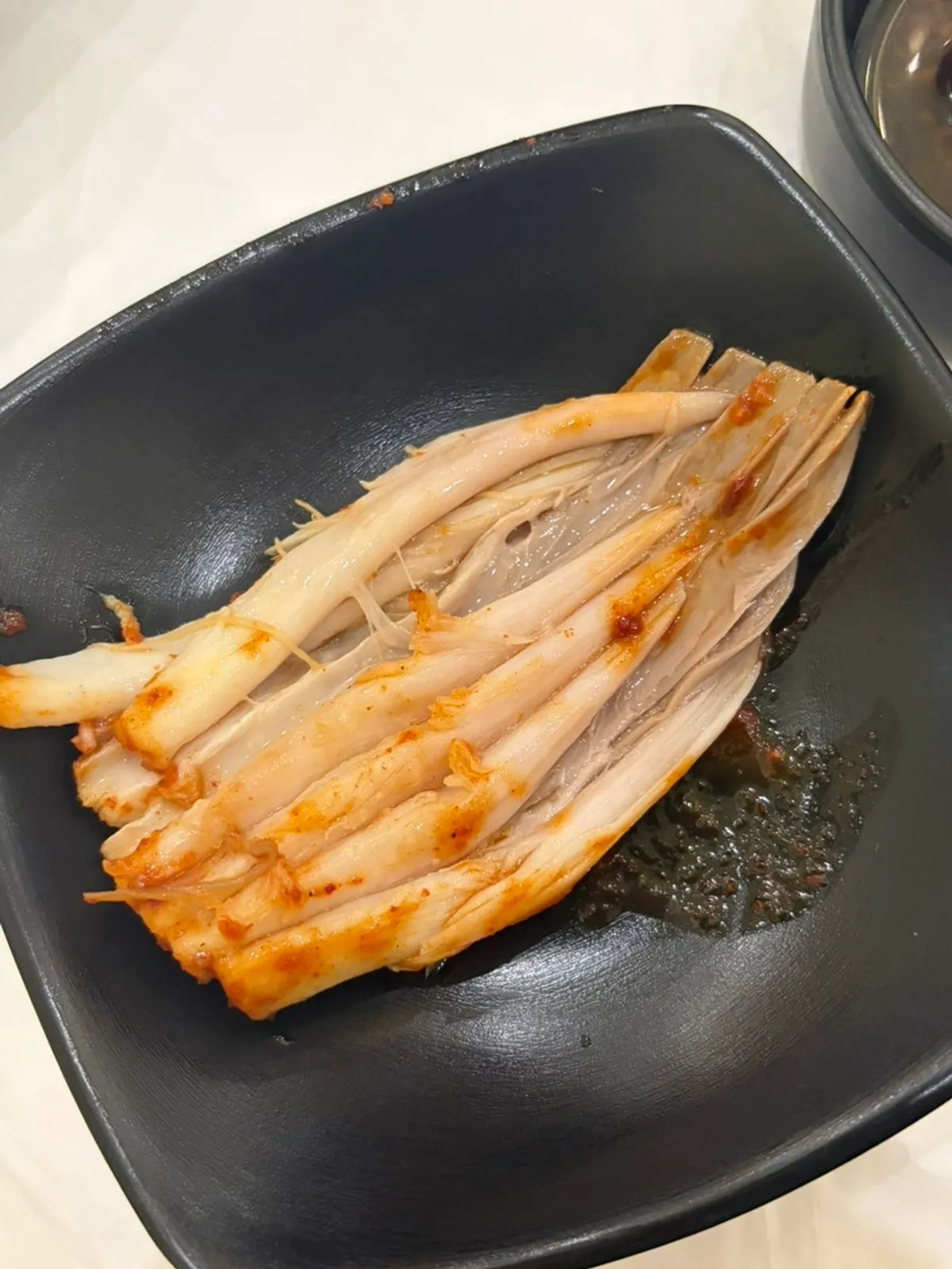 A plate of pro-gaori-jjim topped with red sauce