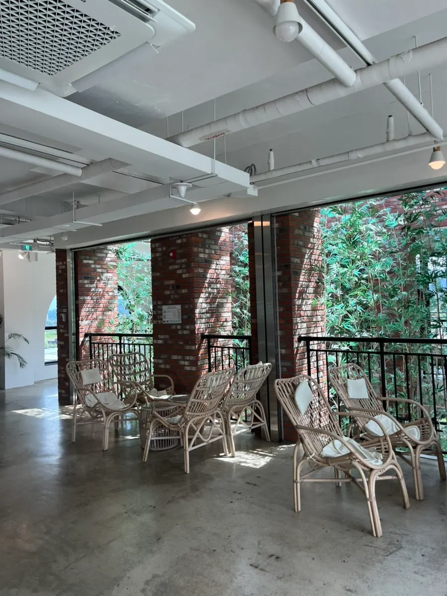 Autumn foliage view through floor-to-ceiling windows and photo spots