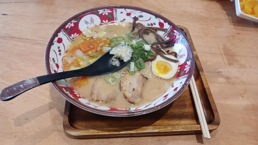 Tonkotsu ramen topped with egg and chashu