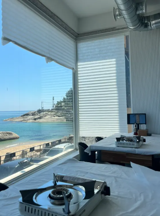 Window seat at Deungdae Gotgan overlooking Deungdae Beach