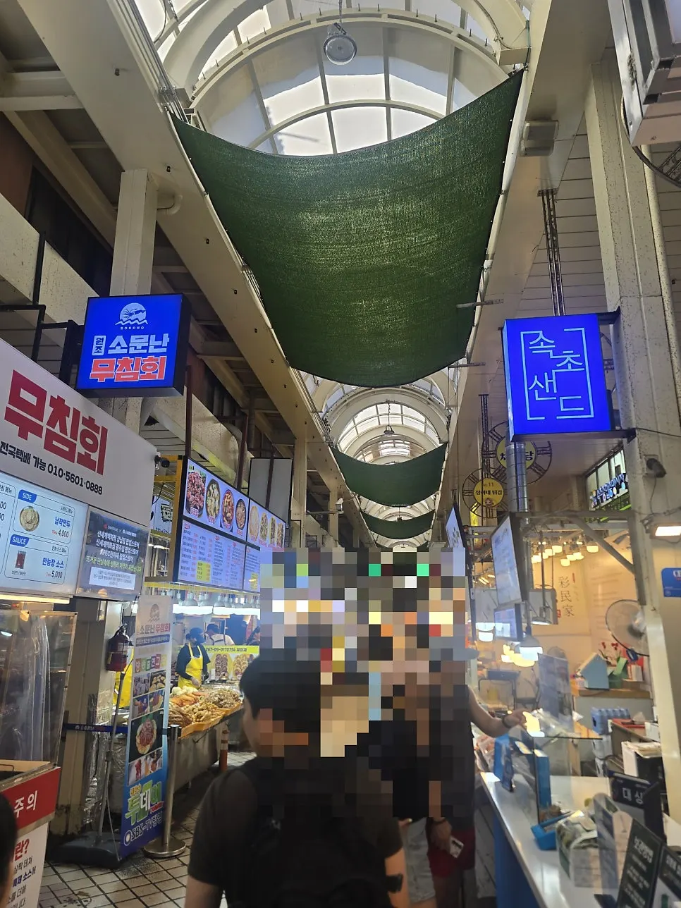 Signboard noting the shop has been running since 1997