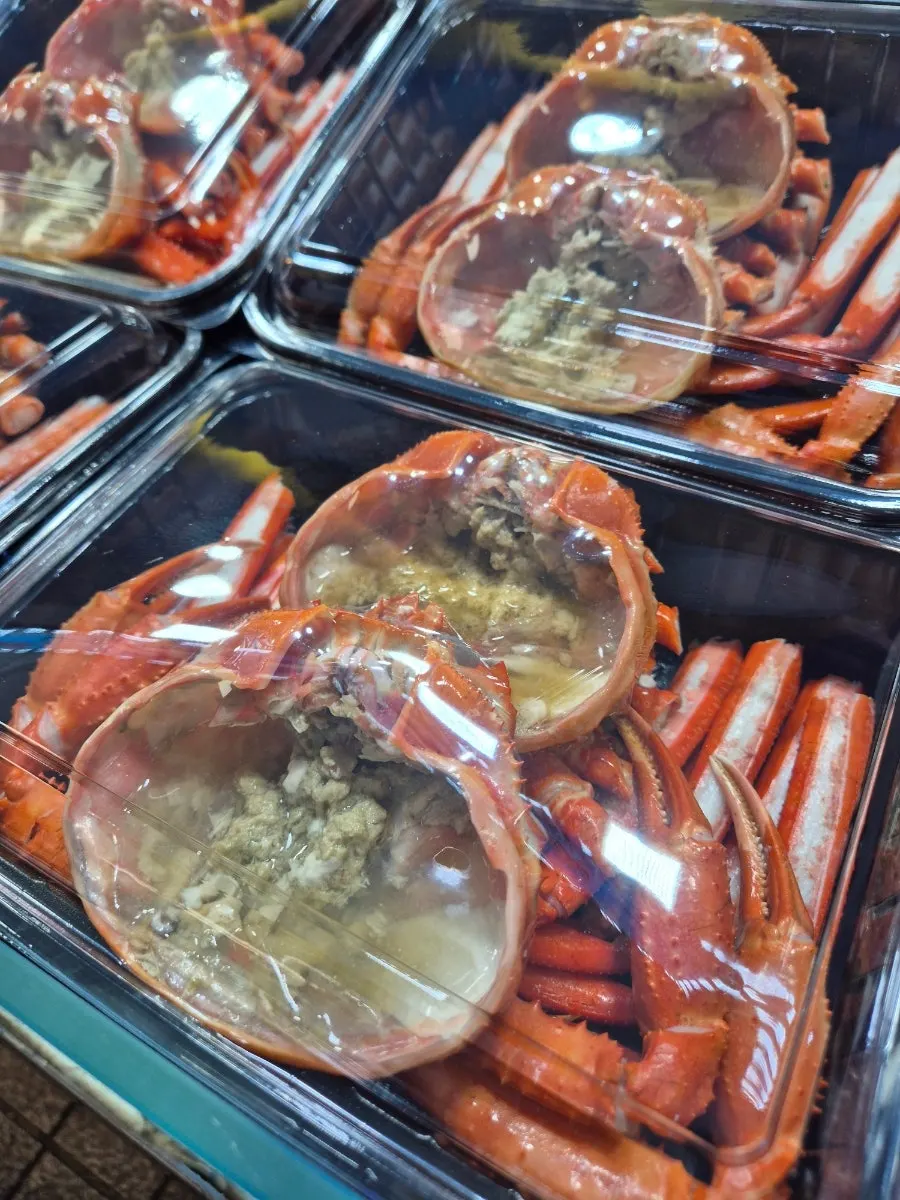 Red snow crab lunchbox packed in an insulated cooler bag