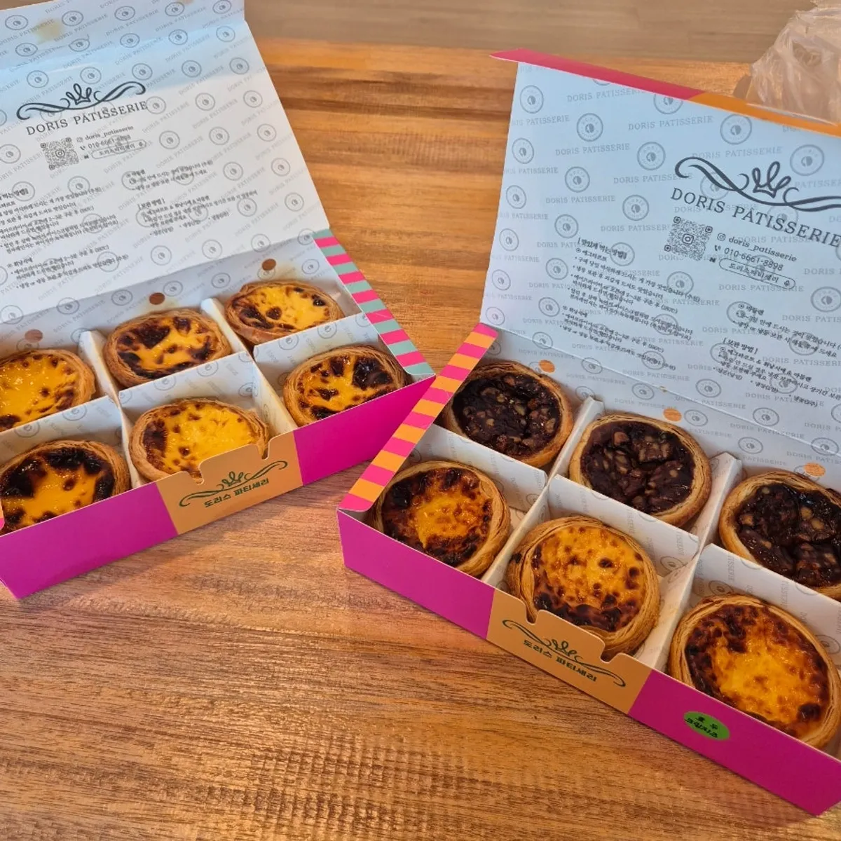 Box opened to reveal six egg tarts