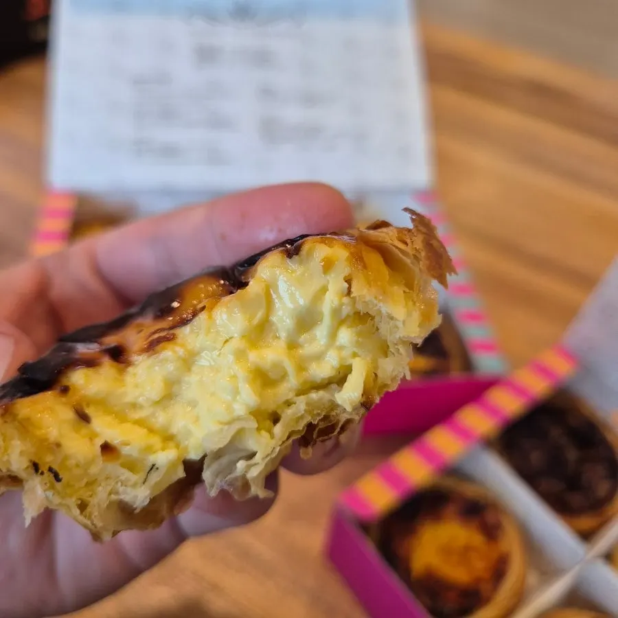 Cross-section of an original egg tart with custard cream