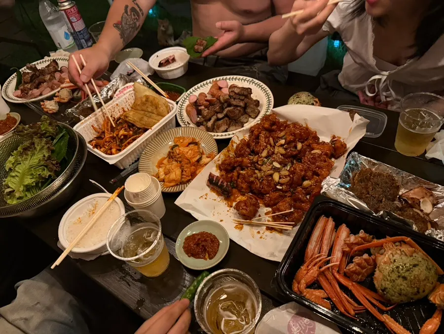 A generous spread of dakgangjeong and squid sundae served together