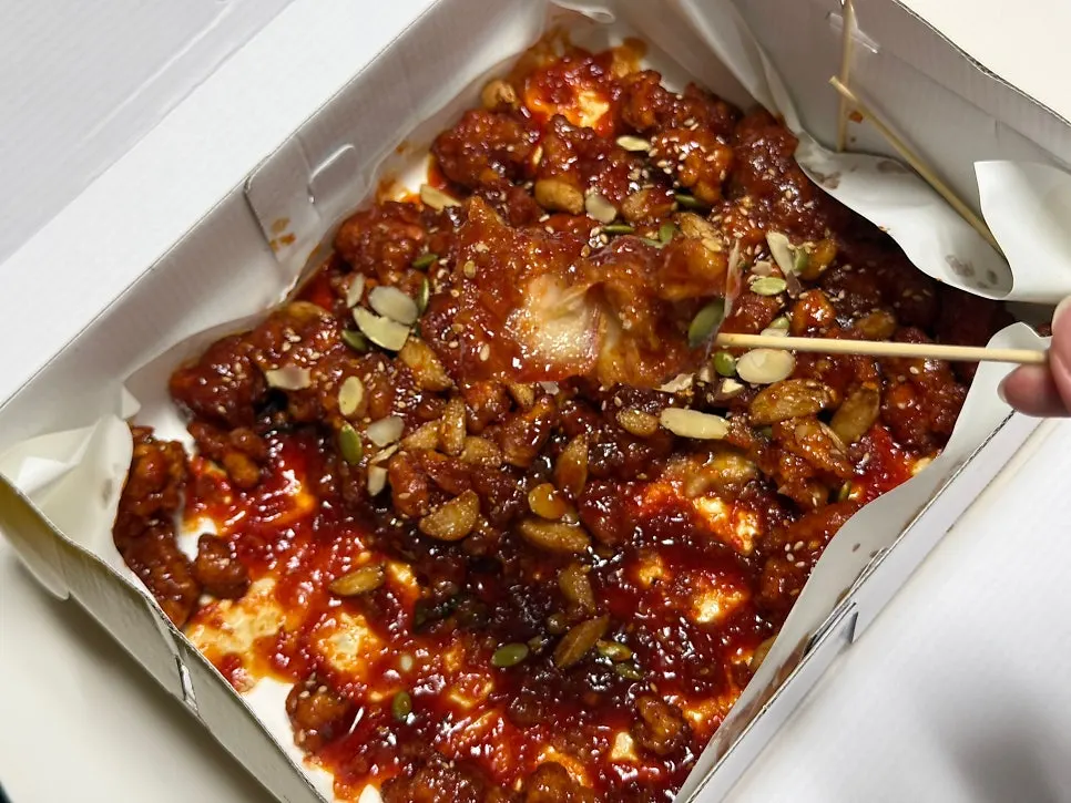 A piece of spicy garlic dakgangjeong