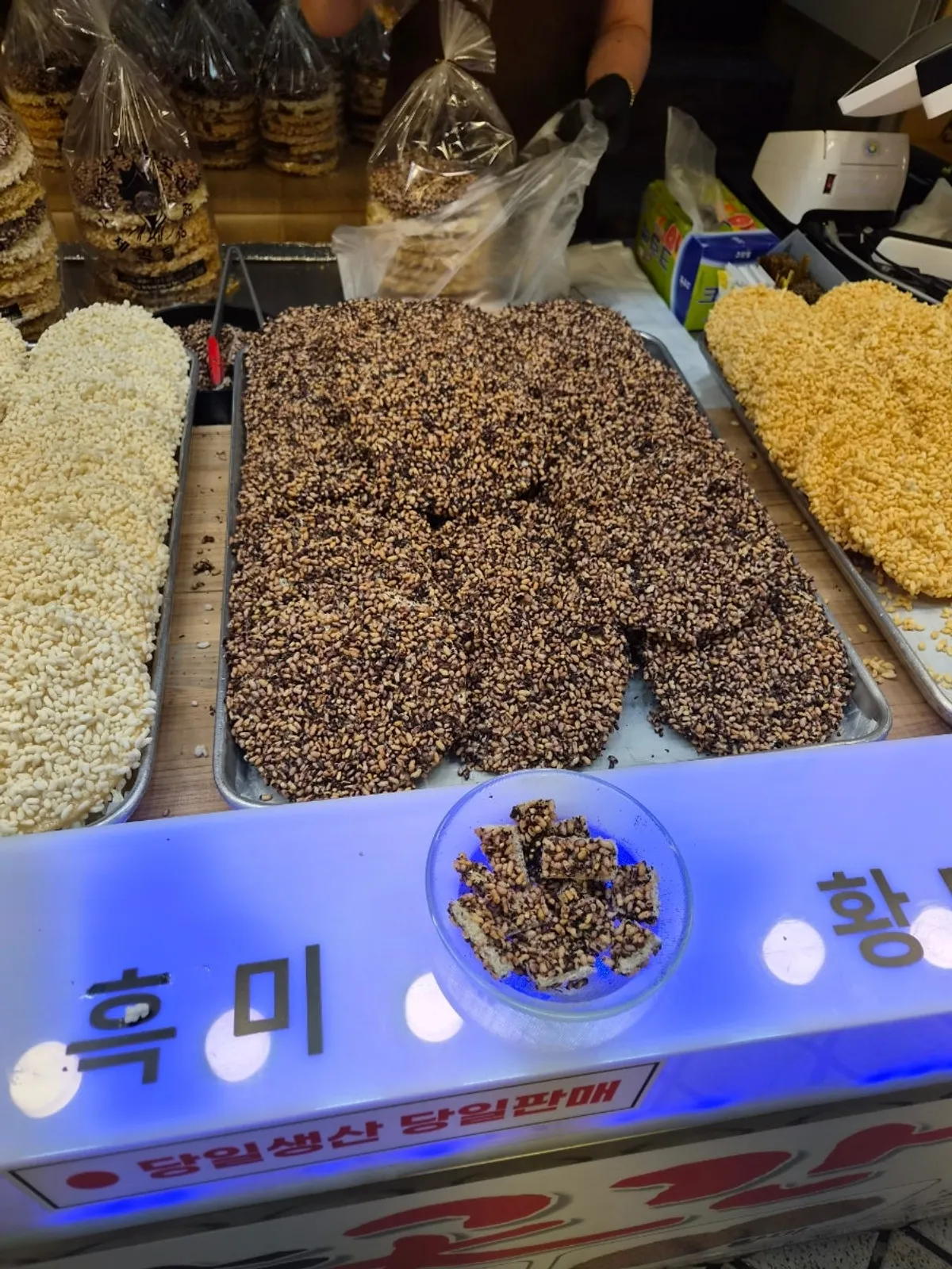 Brown rice, black rice and white rice gangjeong bought at Sokcho Central Market