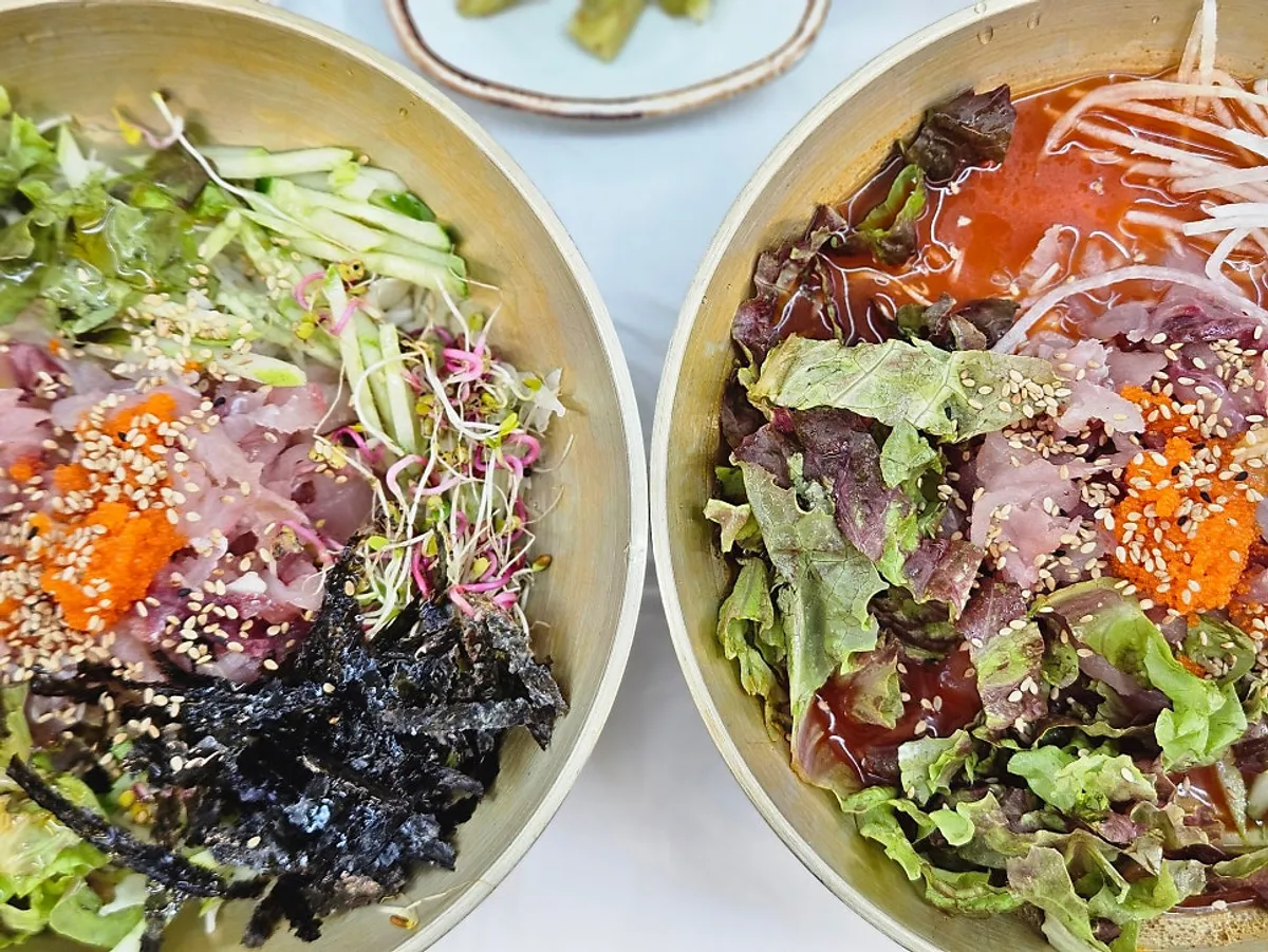 Ordered hwanggeum mulhoe and hwanggeum hoedeopbap set on the table