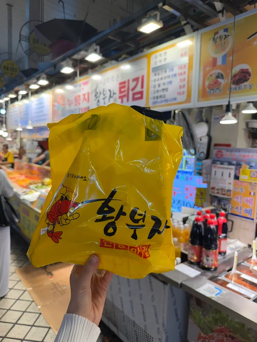 Staff packing Hwangbuja Twigim tempura for takeout