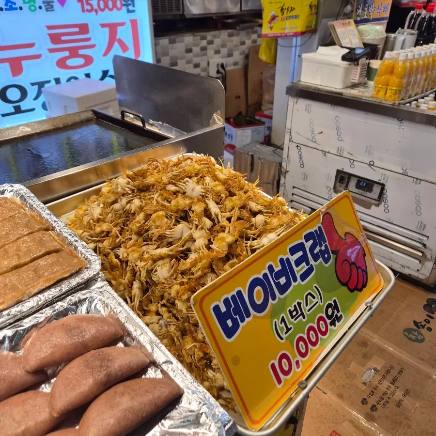 Assorted fried foods on display at Hwangbuja Twigim