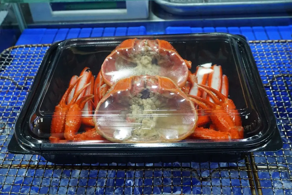 Ordered red snow crab lunchbox and rice ball packed for takeaway