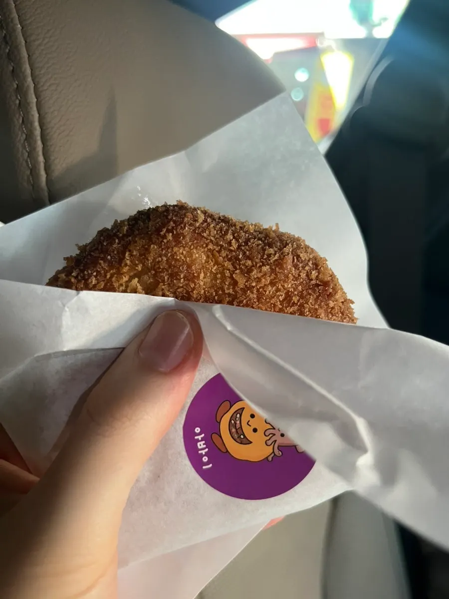 Eating warm croquettes in the car