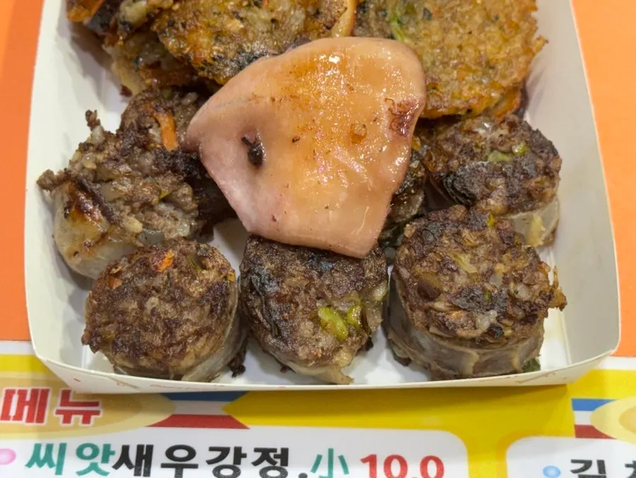 A piece of nurungji squid sundae stuffed full of filling