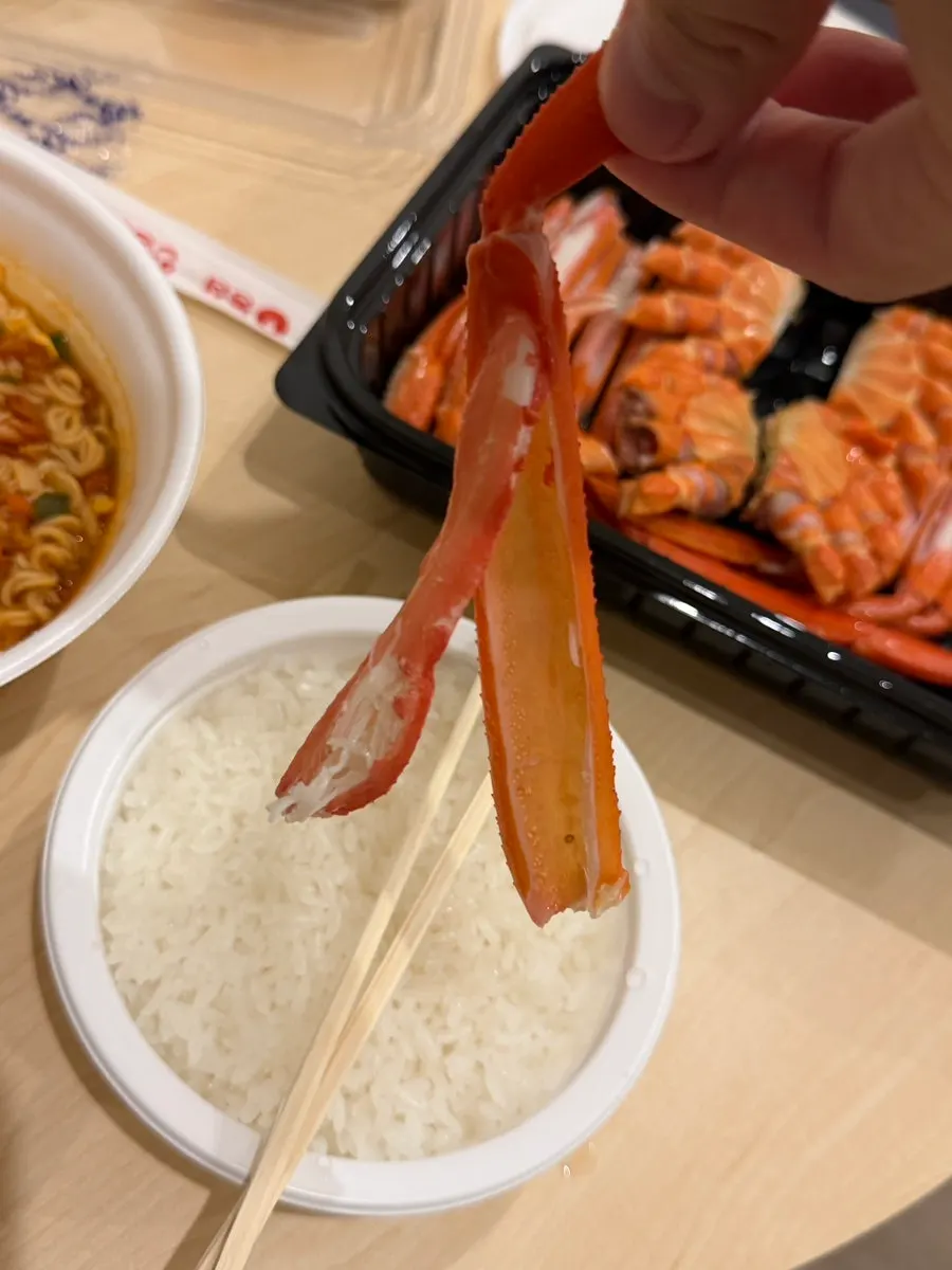 Cracked-open red snow crab leg meat