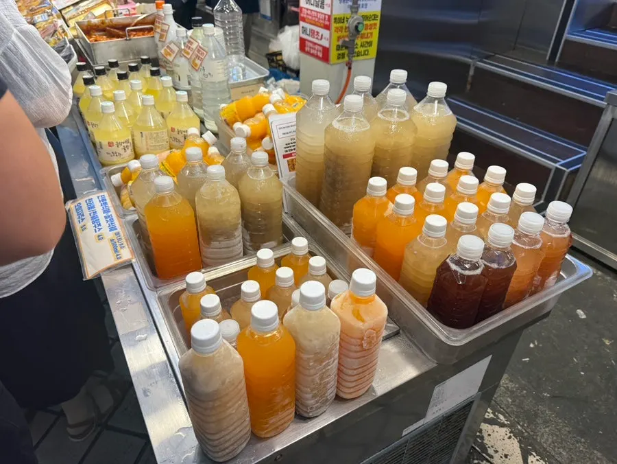 Fried snacks and squid sundae displayed on the counter at Ddogi-ne Twigim