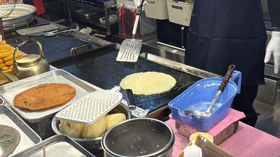 Potato pancake batter being ground and made to order