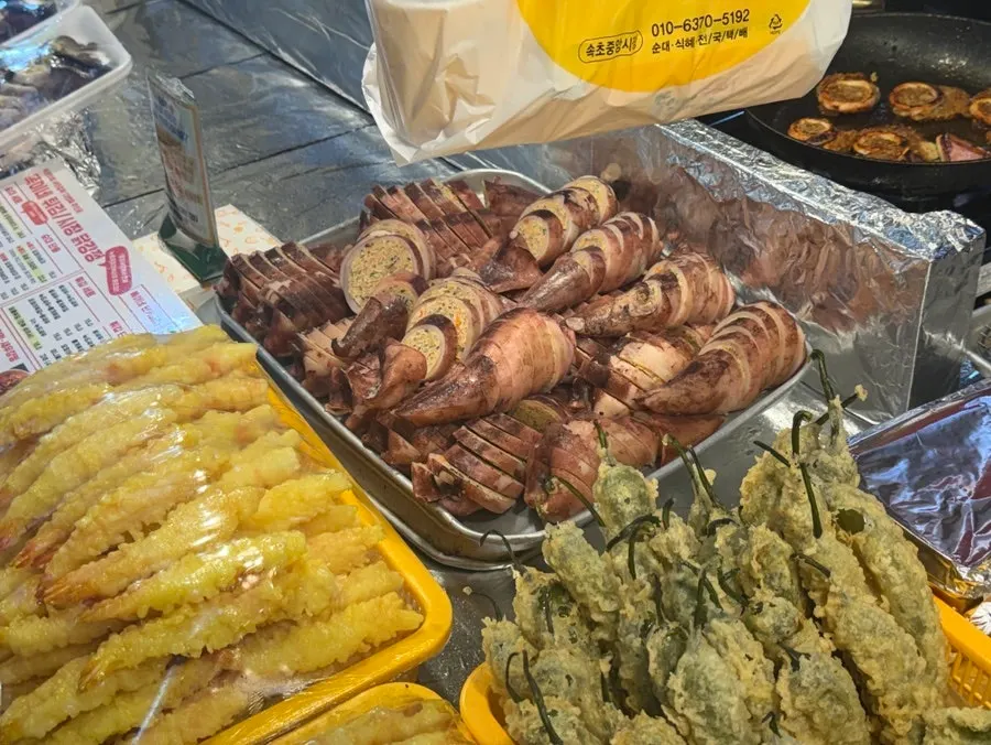 Busy cooking counter at Ddogi-ne Twigim with orders piling up