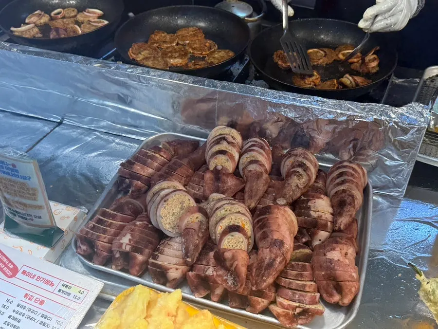 Customers gathered outside Ddogi-ne Twigim in September at Sokcho Jungang Market