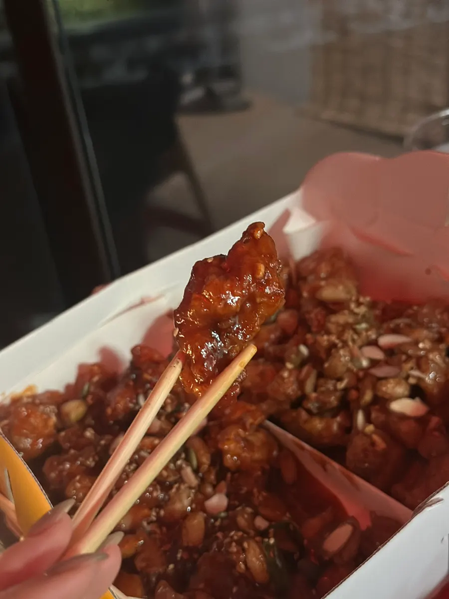 Honey-sweet garlic fried chicken topped with nuts