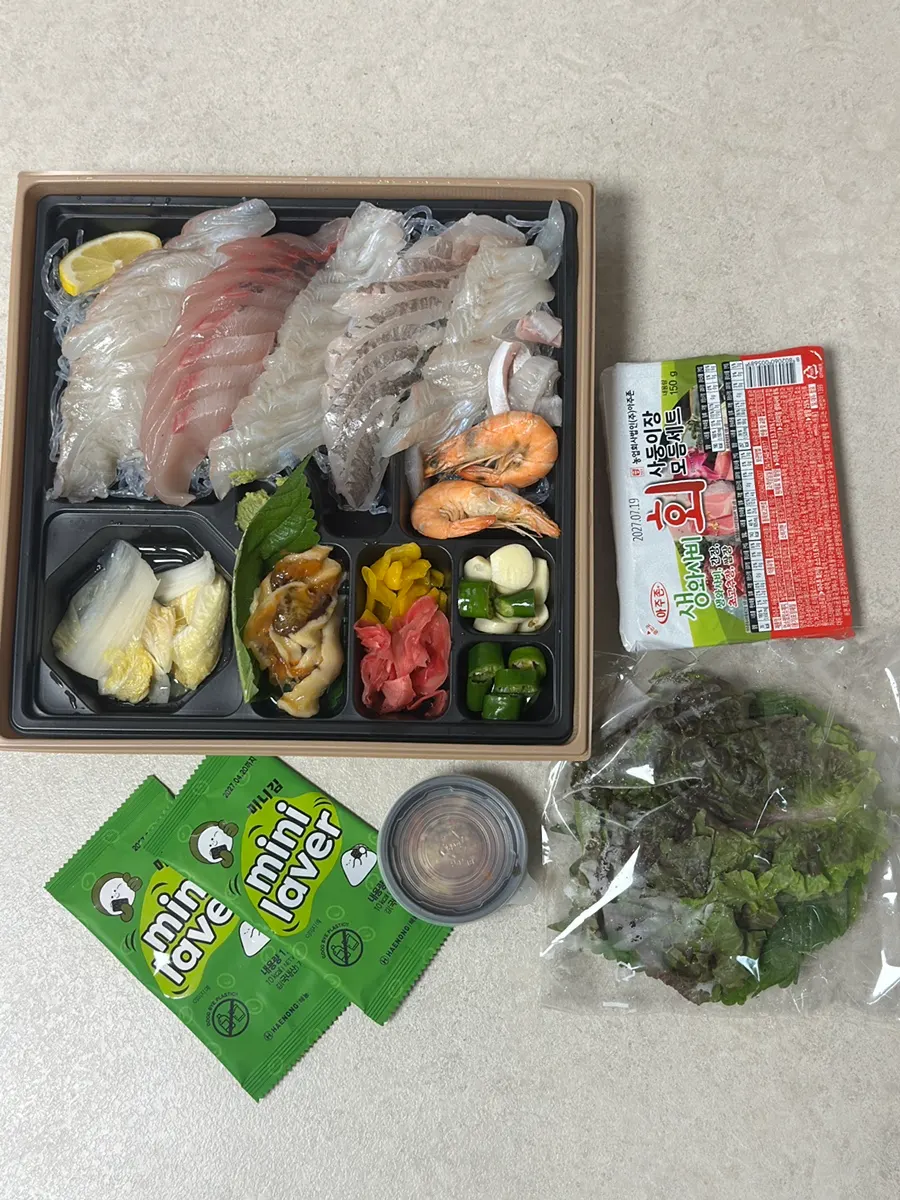 Sashimi packed with ssam vegetables and sides