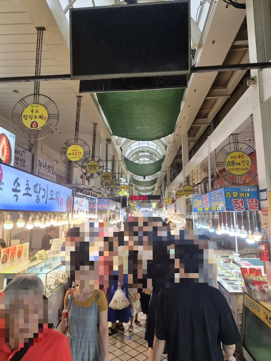 Sokcho Central Market bustling with people browsing food stalls