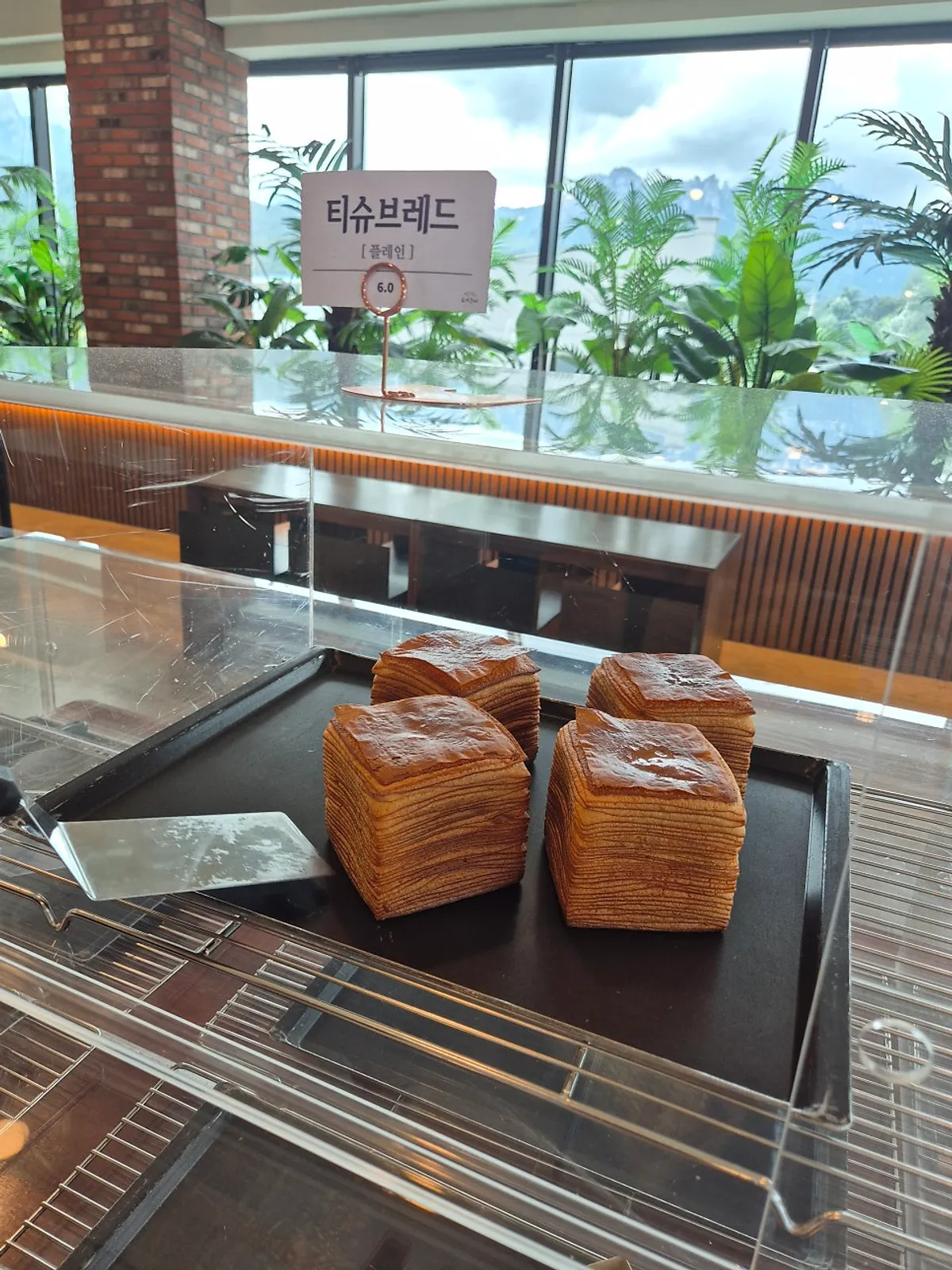 Various breads on display at Cafe Neorae's bakery counter