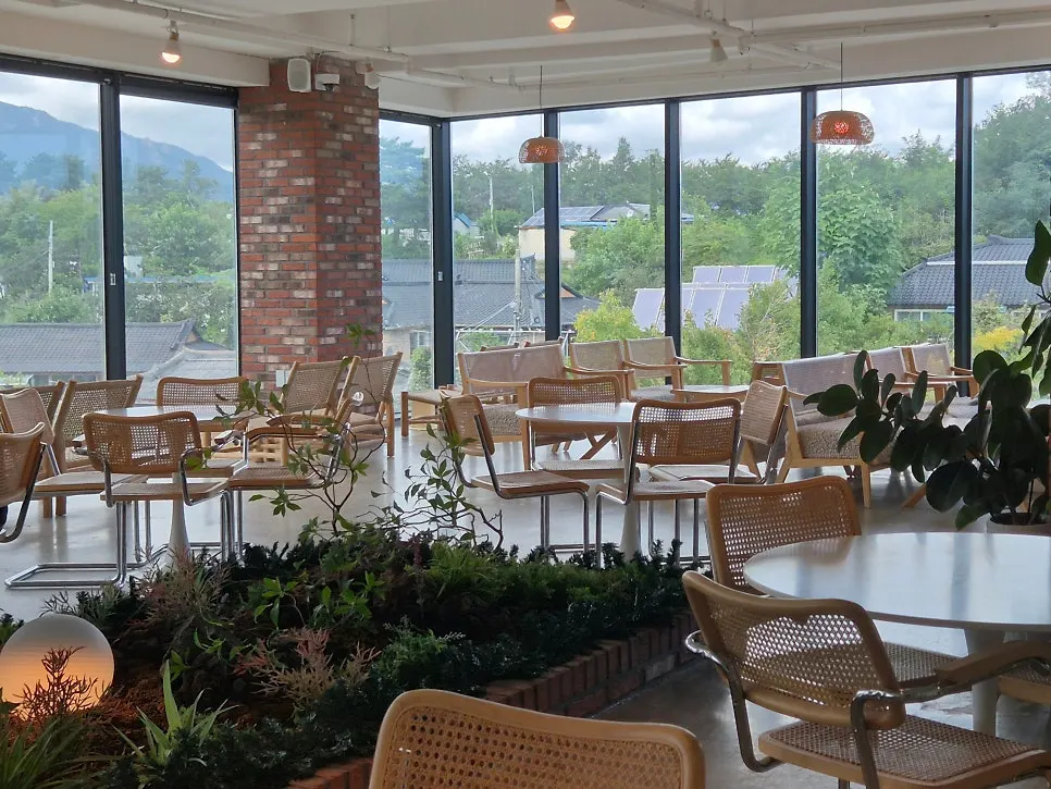 Spacious table seating spread throughout Cafe Neorae