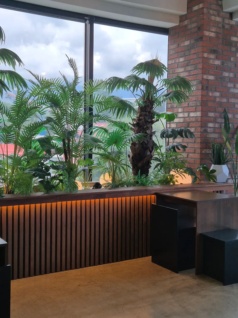 Mountain-view seating by the floor-to-ceiling windows at Cafe Neorae