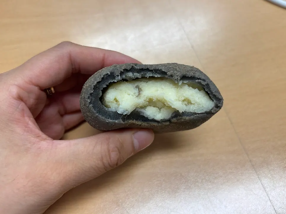 Potato filling inside a halved potato bread