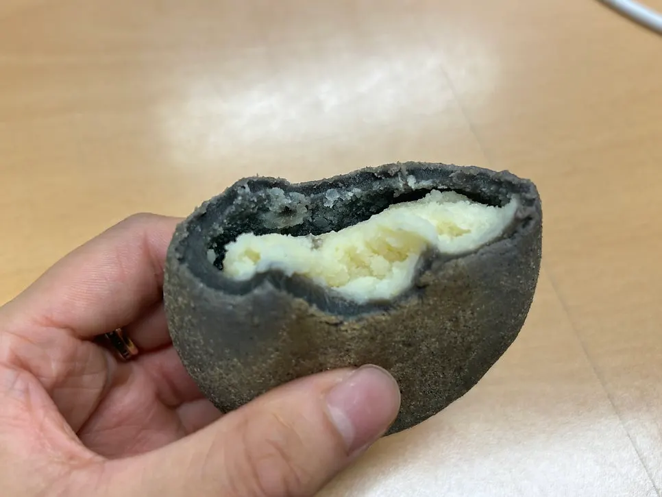 Sokcho Bultan Gamja Bread held in hand