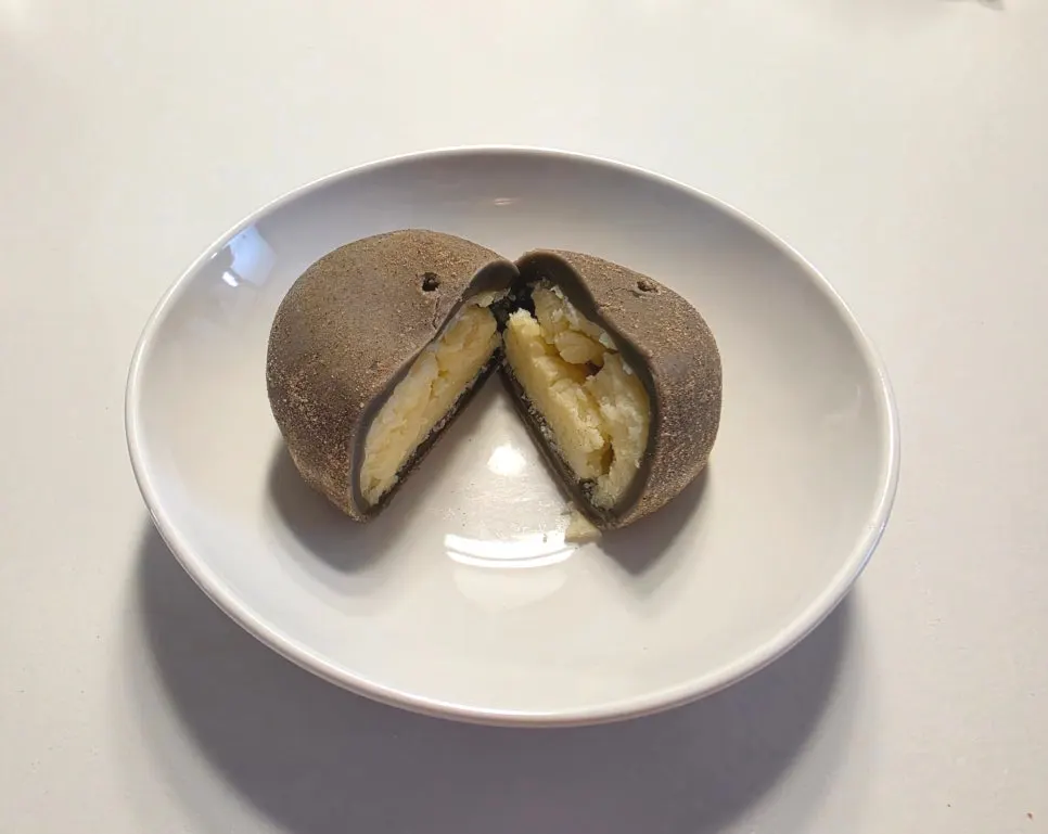 Cross-section of potato bread cut in half showing the potato filling