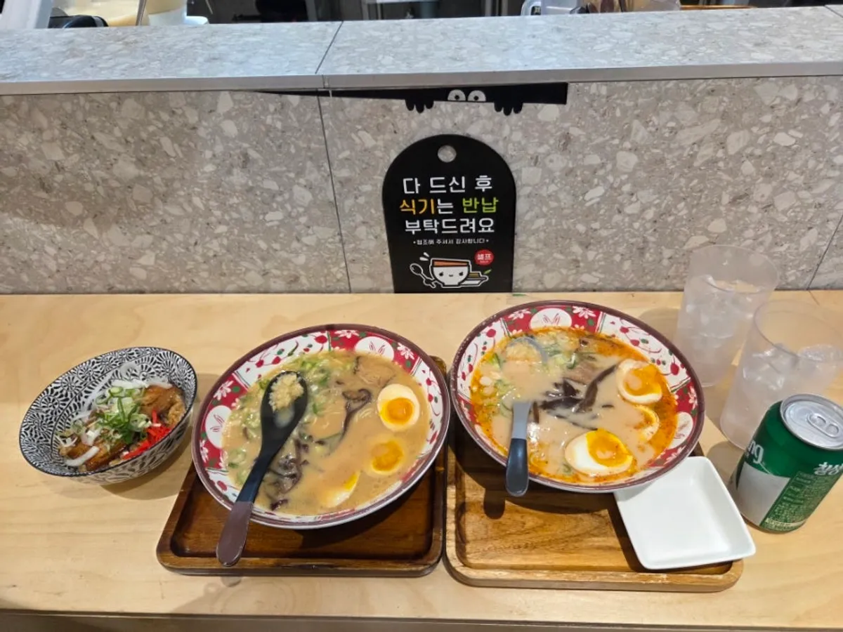 Miso ramen, karai ramen and butadon spread on the table