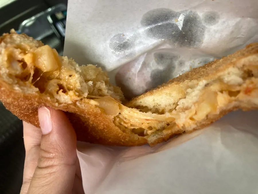 Eating croquettes straight from the box in the car