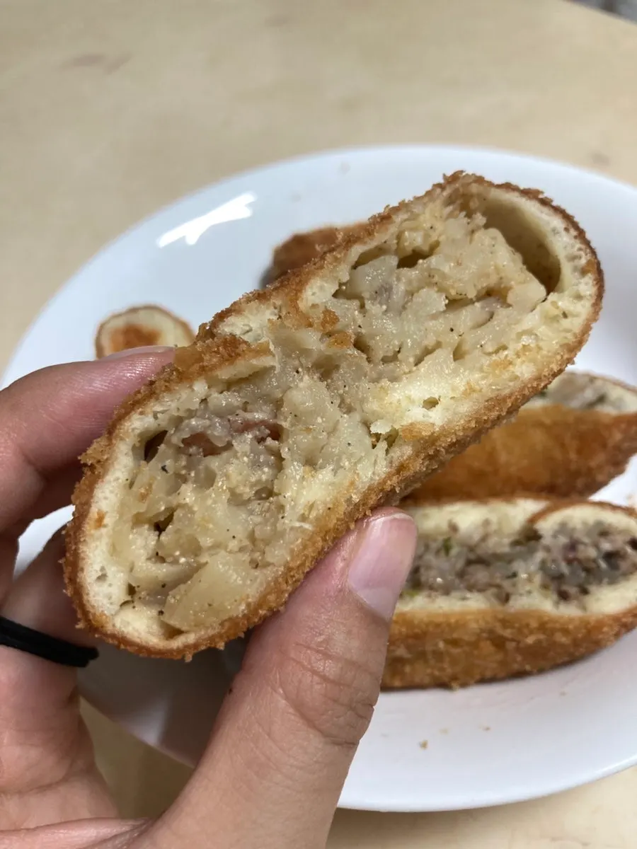 Croquette cut in half showing the filling inside