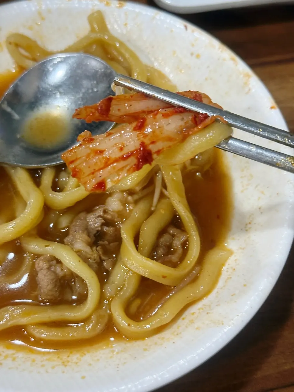 Kimchi and white kimchi served alongside the jangkalguksu