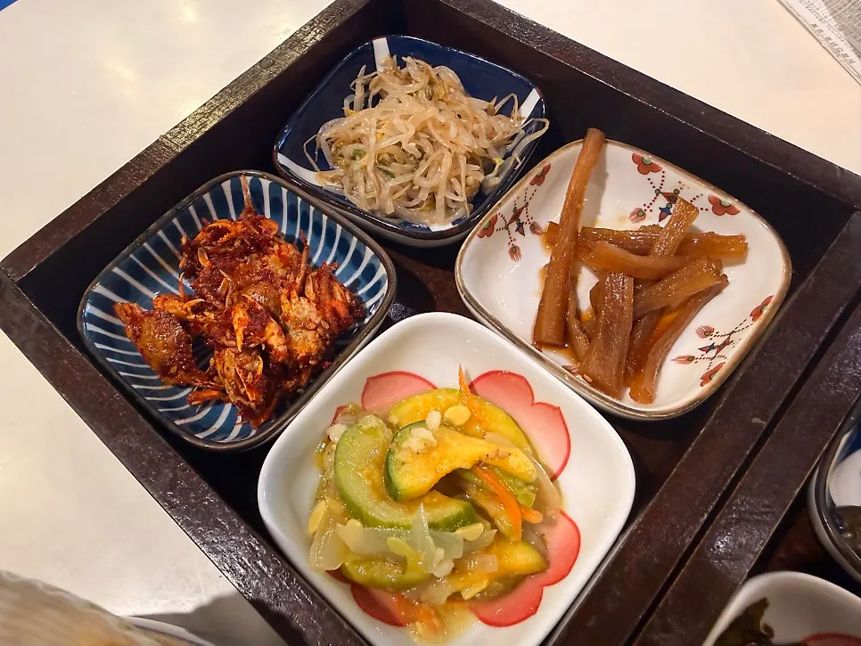 Assorted seafood in soy sauce with side dishes