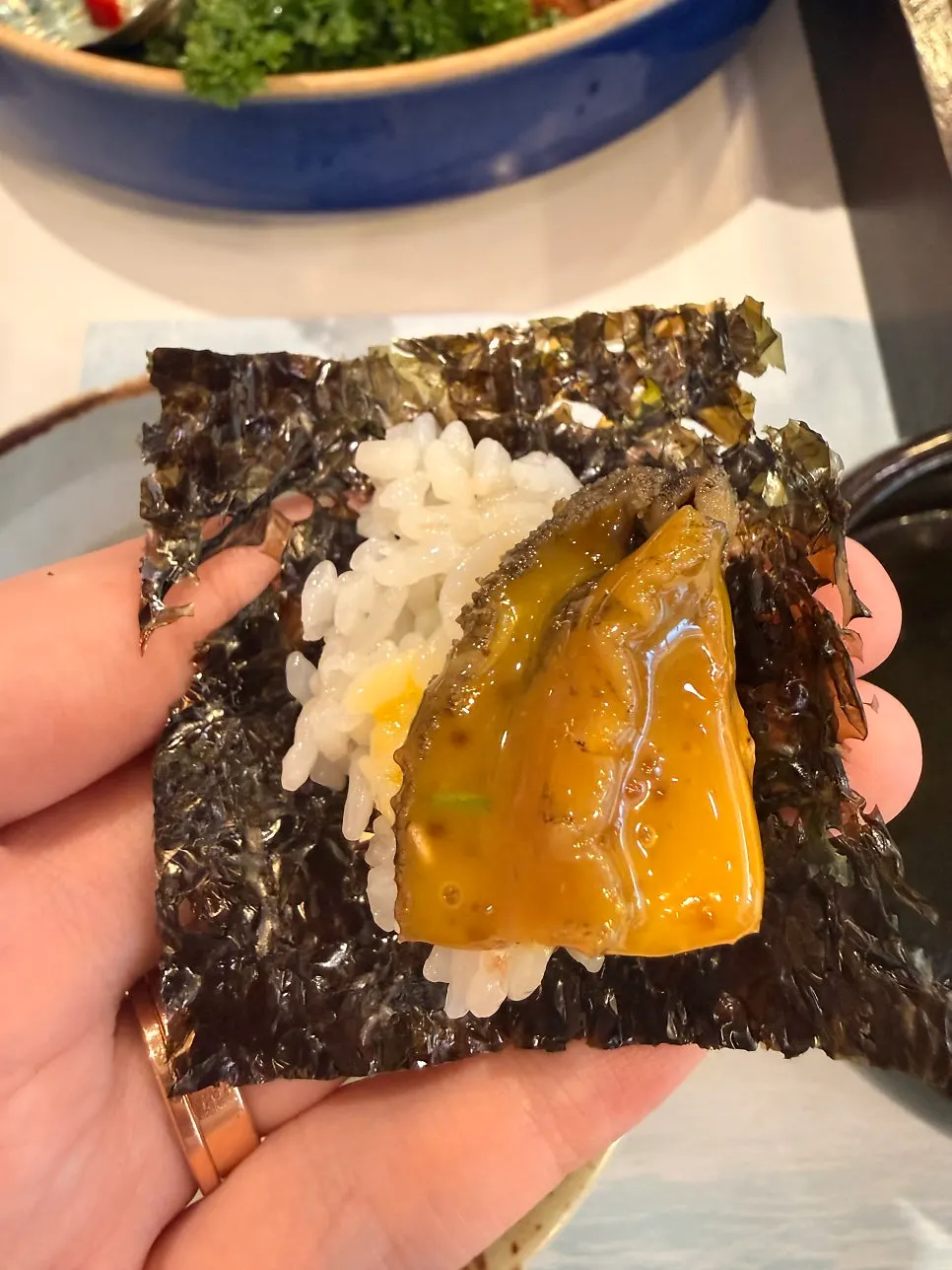 Seafood in soy sauce served with roasted seaweed