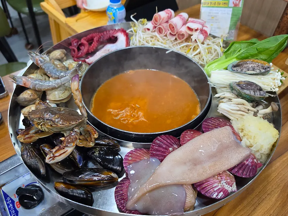 Seafood flower platter topped with octopus, squid, blue crab and abalone
