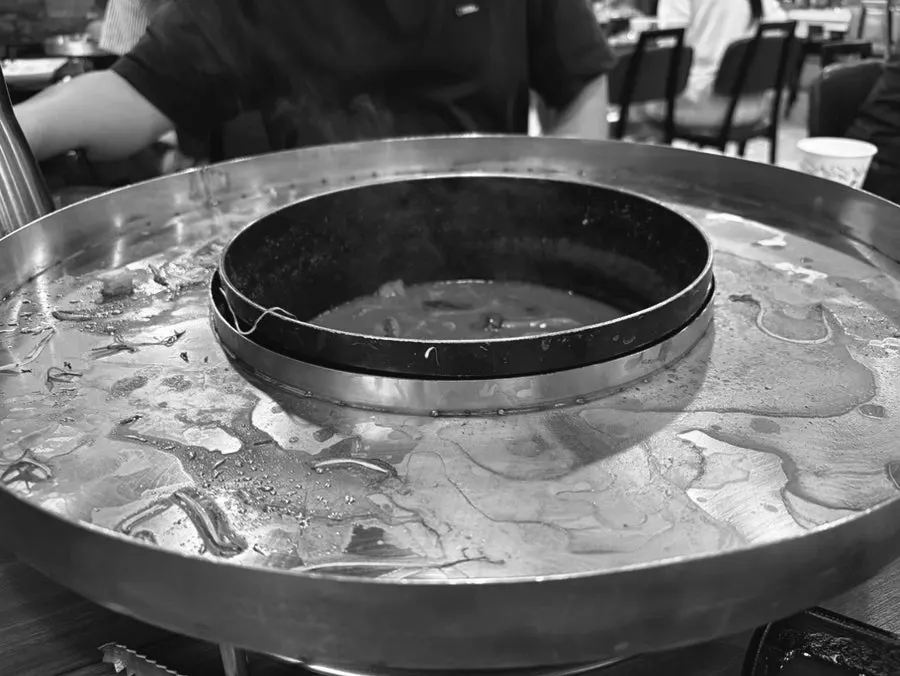 A pot filled with seafood shells