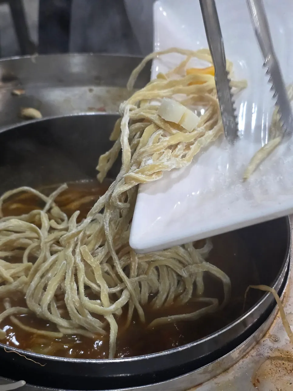 Fresh house-made noodles added to the pot